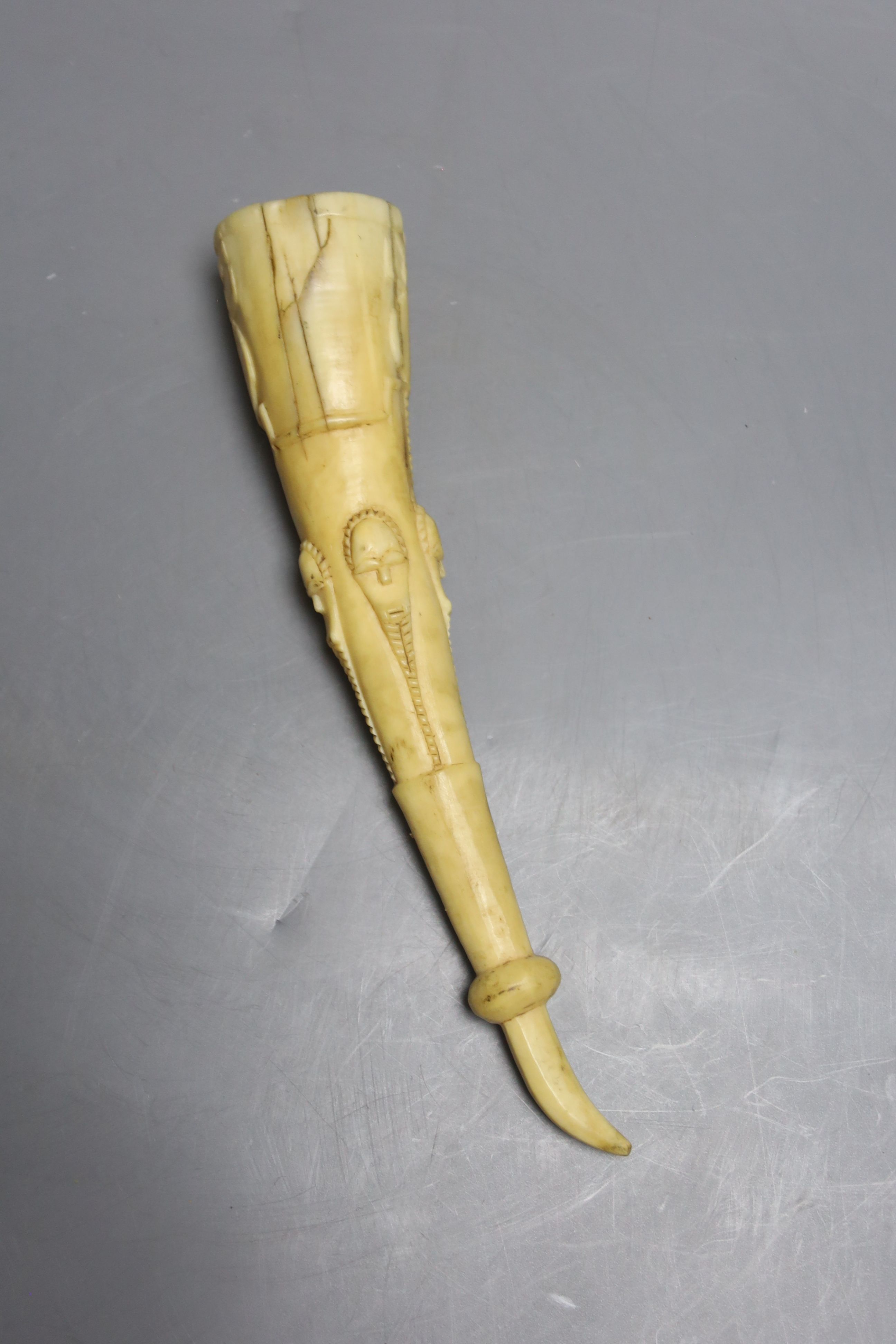 A 19th century West African tusk cup, length 22cm